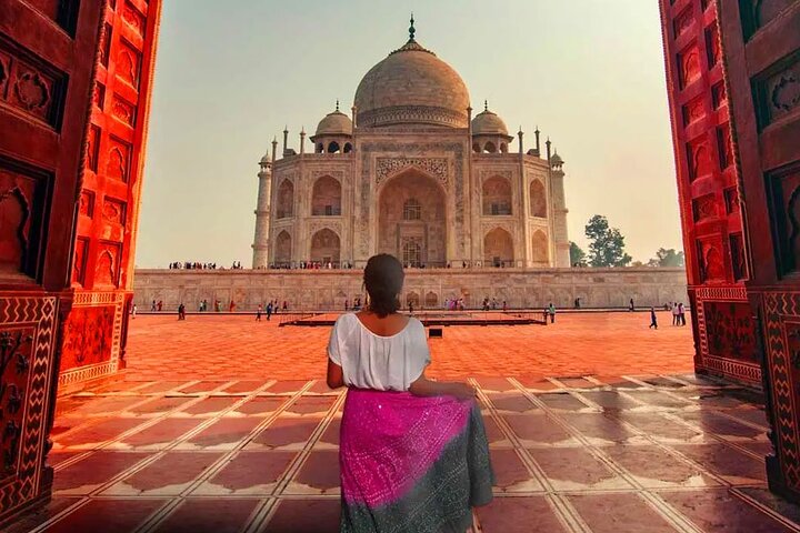 Traveler enjoying the Taj Mahal during a sunrise tour in Agra