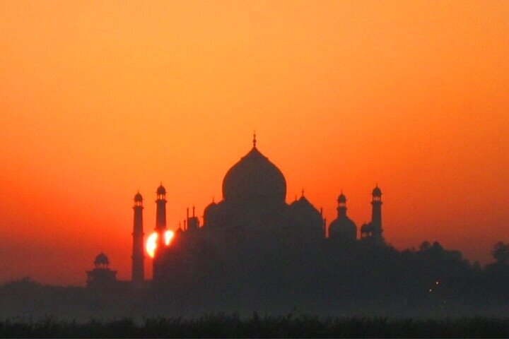 Taj Mahal silhouette during sunrise in Agra
