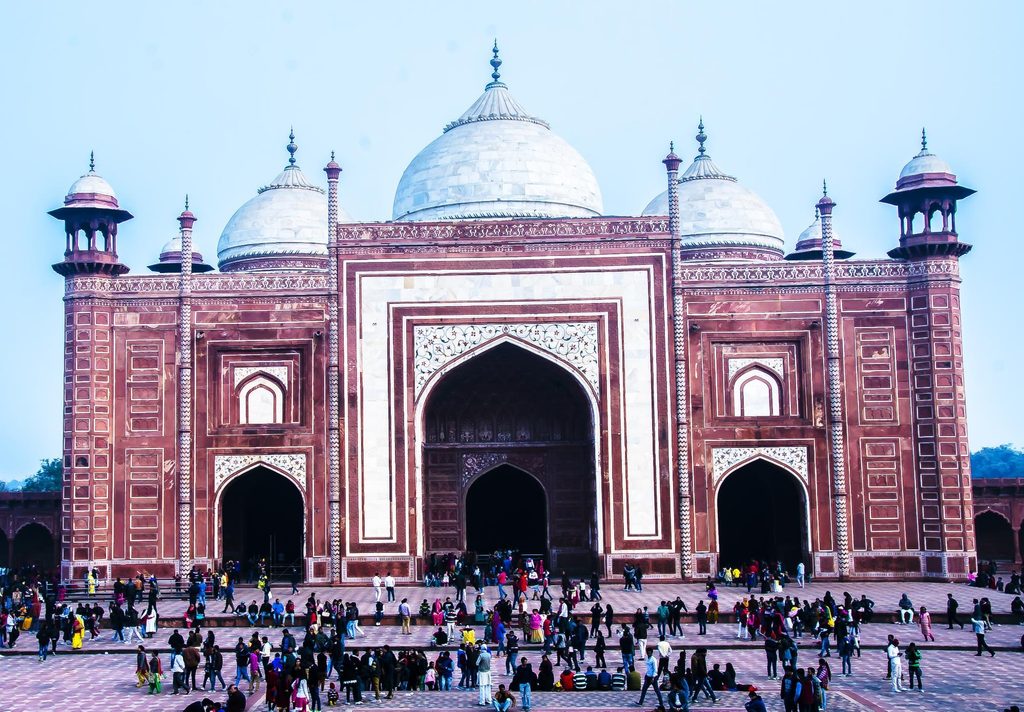 The monumental red sandstone Great Gate (Darwaza-i Rauza) of the Taj Mahal complex.