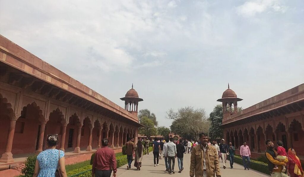 Visitors walking inside the Taj Mahal complex in Agra